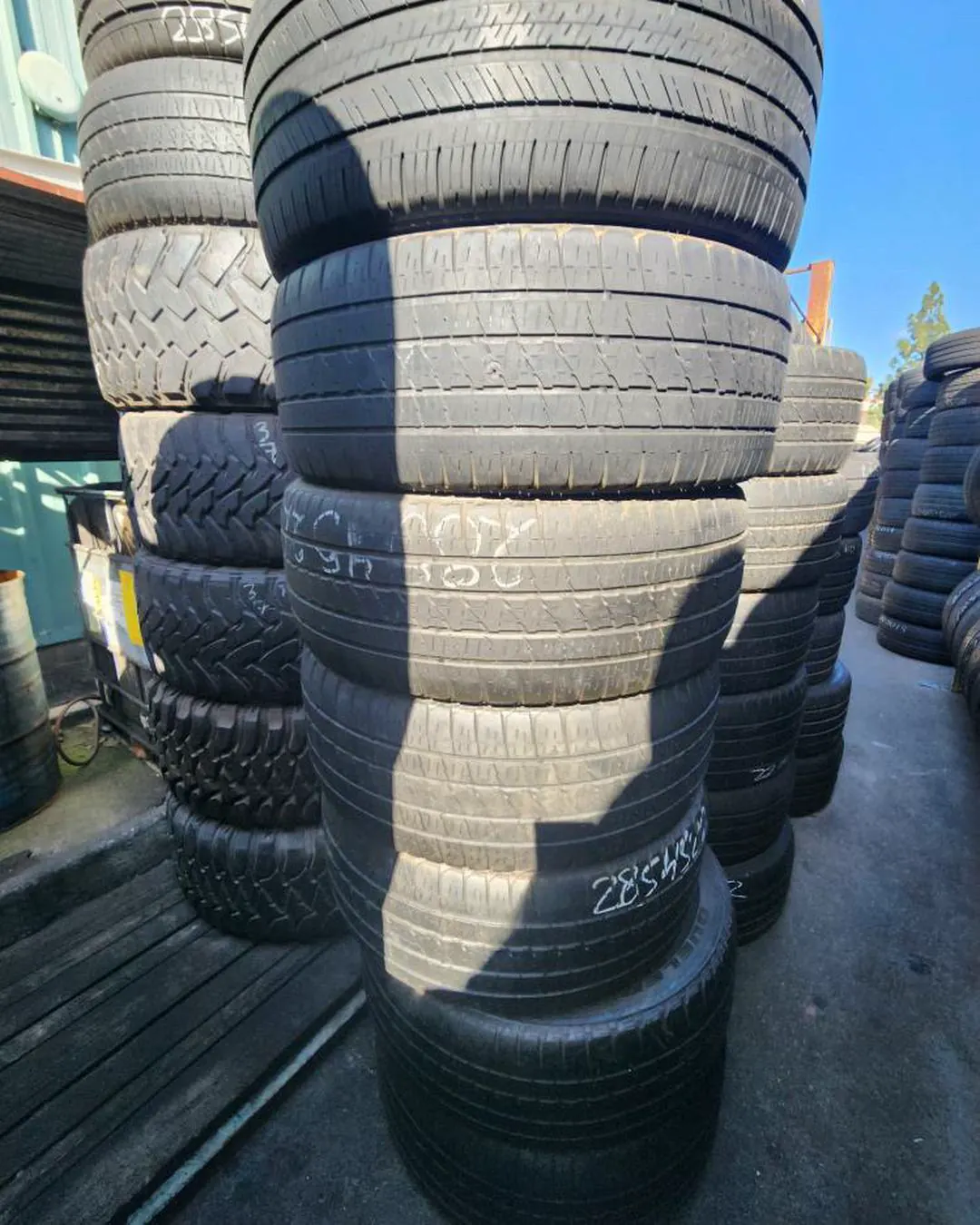 Marked tire sidewall stack with visible sizing text