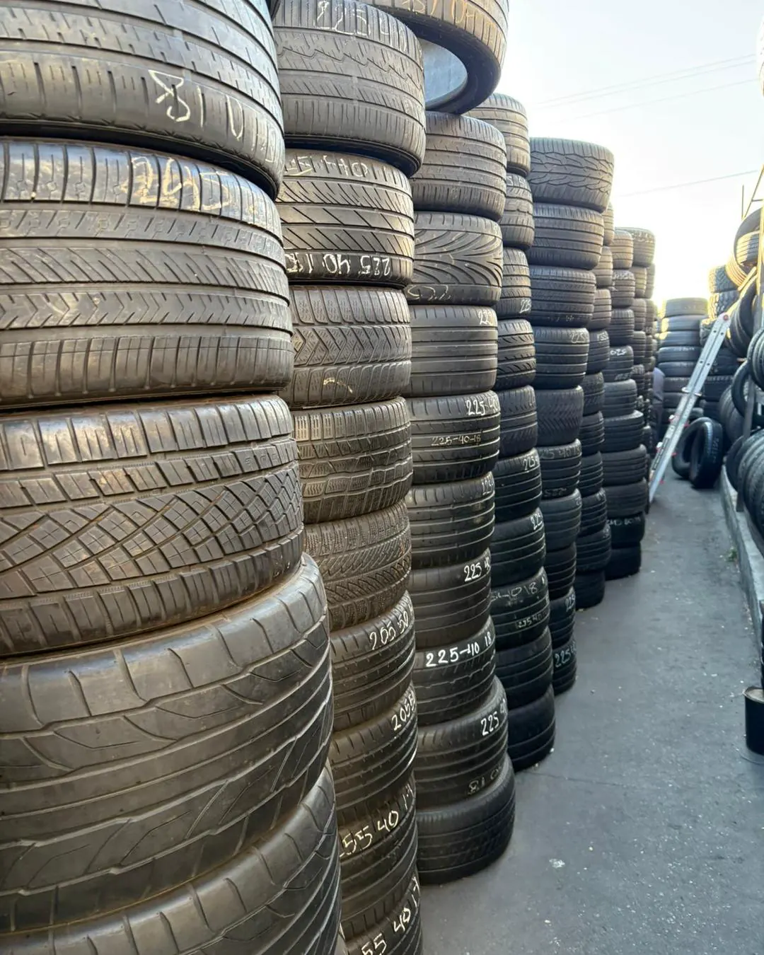 Open yard floor with rows of staged tires